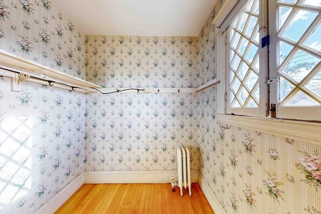 interior space featuring radiator and hardwood / wood-style floors