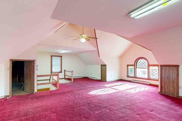 bonus room with a baseboard radiator, vaulted ceiling, carpet flooring, and ceiling fan