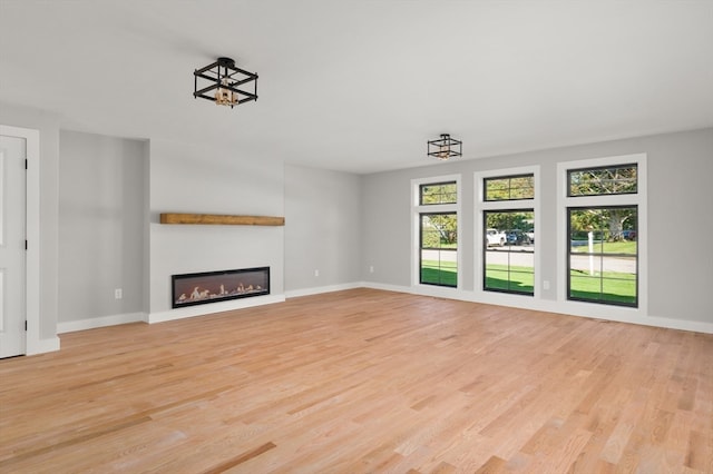 unfurnished living room featuring light hardwood / wood-style flooring