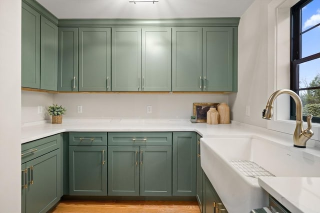 13 Alden Rd, Andover, MA 01810 - kitchen with light countertops, a sink, and green cabinets