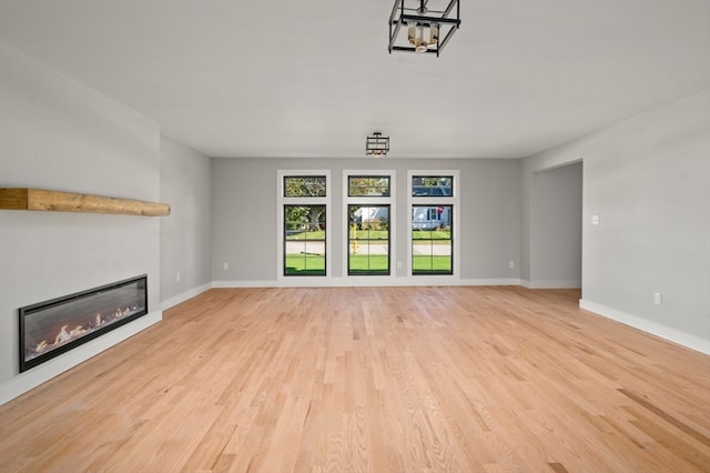 unfurnished living room with light hardwood / wood-style floors