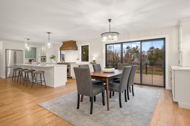 13 Alden Rd, Andover, MA 01810 - dining space featuring a chandelier, light wood-style floors, and a wealth of natural light