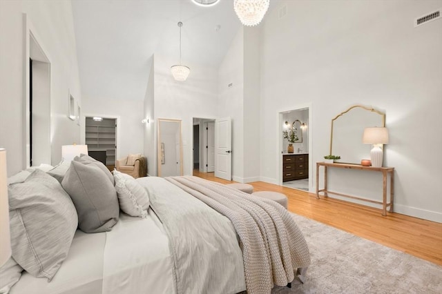 13 Alden Rd, Andover, MA 01810 - bedroom with baseboards, visible vents, high vaulted ceiling, and wood finished floors