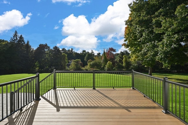 wooden deck with a lawn