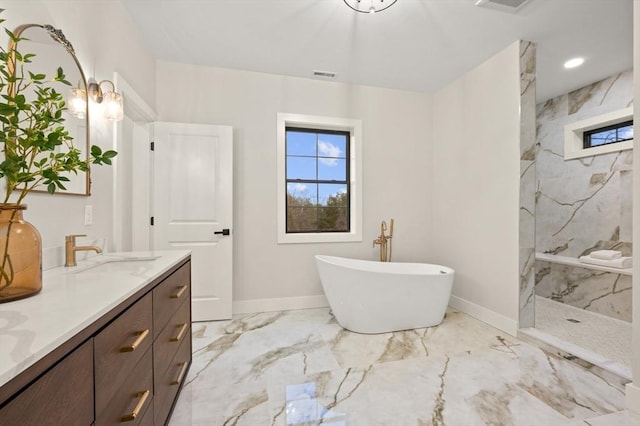 13 Alden Rd, Andover, MA 01810 - bathroom featuring marble finish floor, a freestanding bath, visible vents, a marble finish shower, and baseboards
