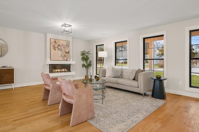 13 Alden Rd, Andover, MA 01810 - living area featuring baseboards, a glass covered fireplace, and wood finished floors