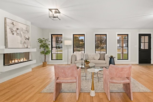 13 Alden Rd, Andover, MA 01810 - living room with baseboards, a glass covered fireplace, and wood finished floors