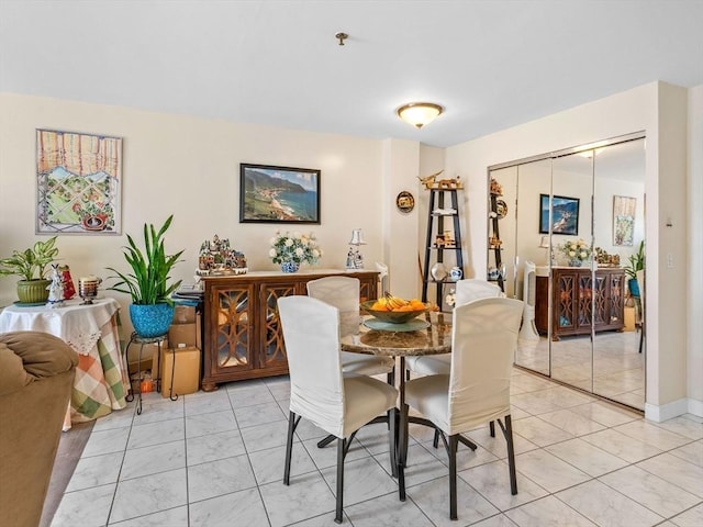 dining room with light tile patterned flooring