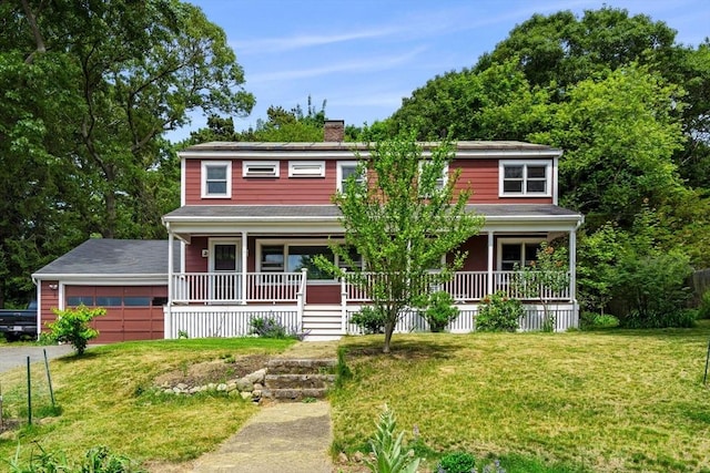 view of front of home with a garage, covered porch, and a front lawn