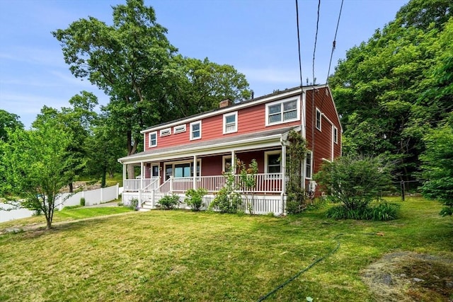 colonial house with a porch and a front lawn