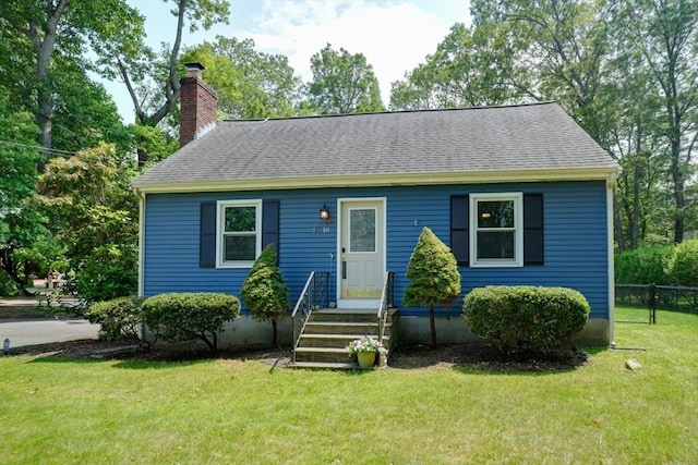 10 Laurel Ln, Bellingham, MA 02019 - view of front of house featuring a chimney and roof with shingles