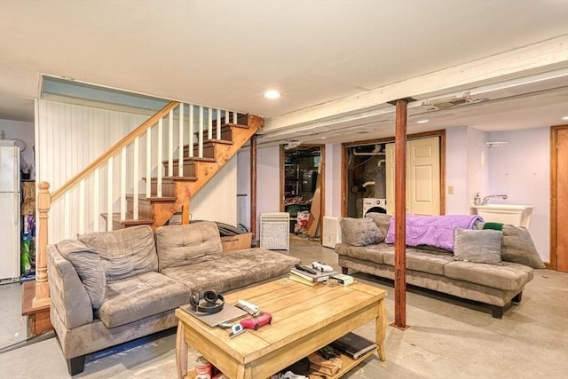 10 Laurel Ln, Bellingham, MA 02019 - living area featuring finished concrete floors, stairway, and recessed lighting