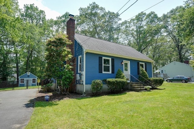 10 Laurel Ln, Bellingham, MA 02019 - view of front of home featuring a chimney, driveway, and a shingled roof