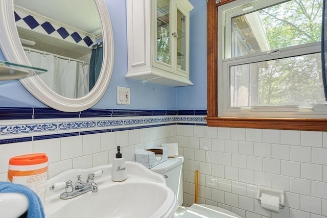 10 Laurel Ln, Bellingham, MA 02019 - full bathroom with tile walls, a wainscoted wall, ornamental molding, and a shower with shower curtain