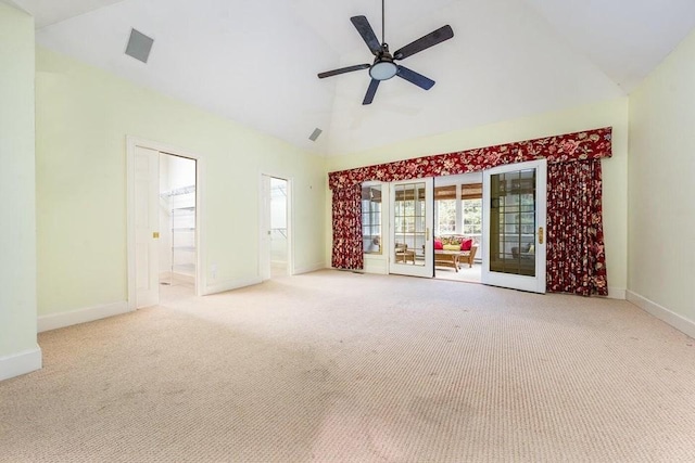 carpeted spare room featuring baseboards, high vaulted ceiling, and a ceiling fan