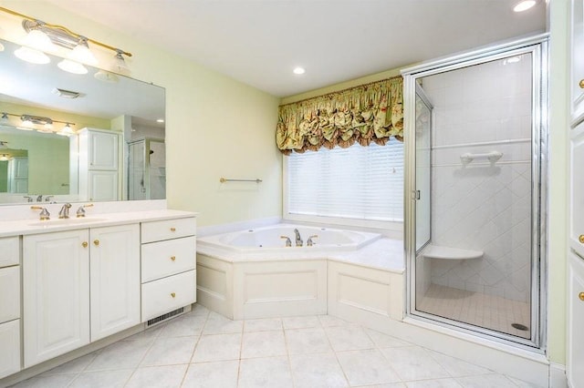 full bathroom with a garden tub, a stall shower, recessed lighting, tile patterned flooring, and vanity