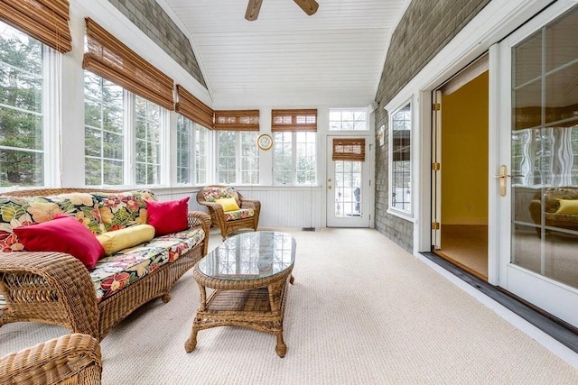 sunroom with ceiling fan and lofted ceiling