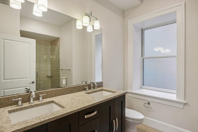 bathroom with vanity, toilet, and walk in shower