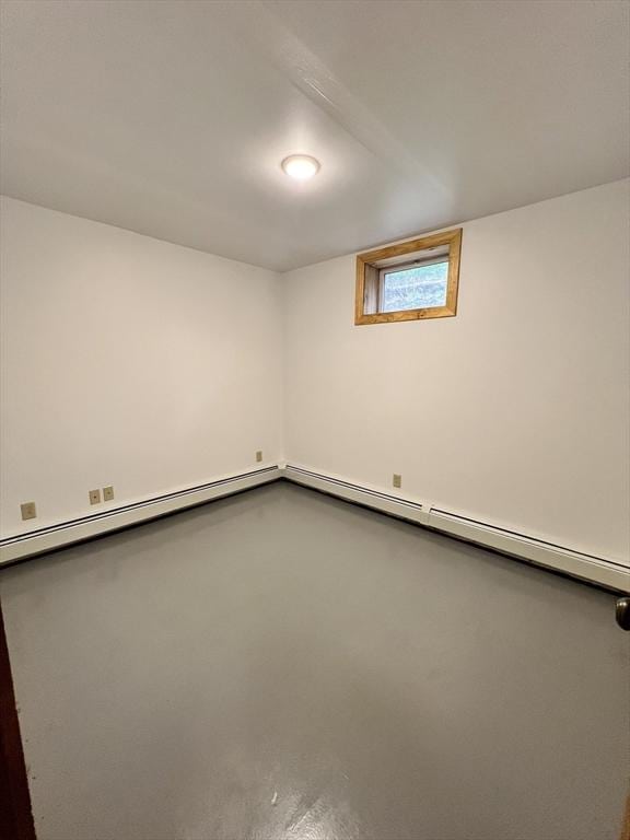below grade area featuring a baseboard heating unit