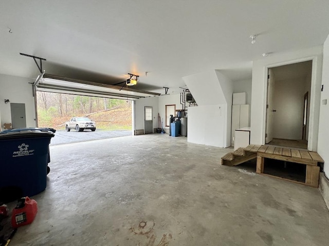 garage featuring a garage door opener and electric panel