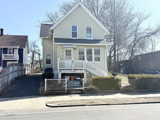 129 Eastern Ave, Springfield, MA 01109 - view of front of property with a fenced front yard and roof with shingles