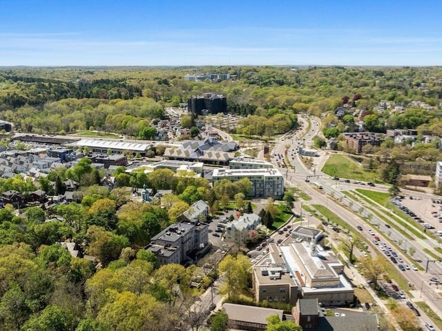 drone / aerial view featuring a forest view