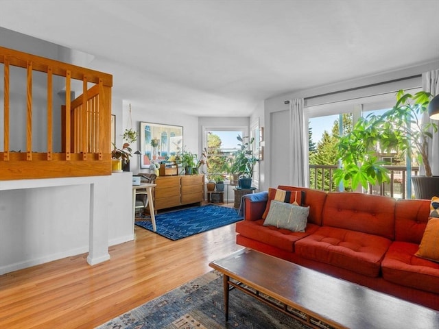 living room featuring baseboards and wood finished floors
