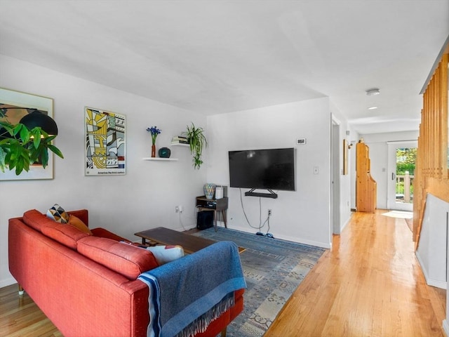 living room featuring wood finished floors and baseboards