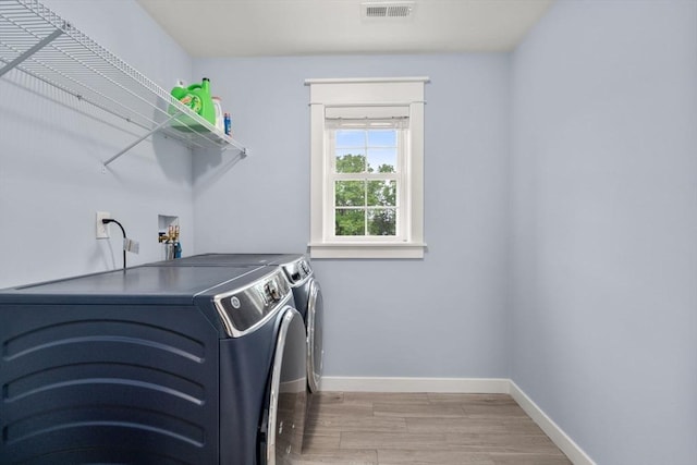9 Baldwin Ct Unit 9, Harvard, MA 01451 - laundry area featuring separate washer and dryer, light wood finished floors, and baseboards