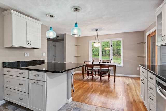 16 Deer Path Unit 1, Maynard, MA 01754 - kitchen with baseboards, dishwasher, white cabinetry, and pendant lighting
