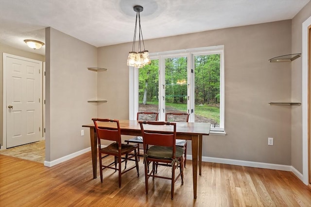 16 Deer Path Unit 1, Maynard, MA 01754 - dining room featuring light wood-type flooring, baseboards, and a chandelier