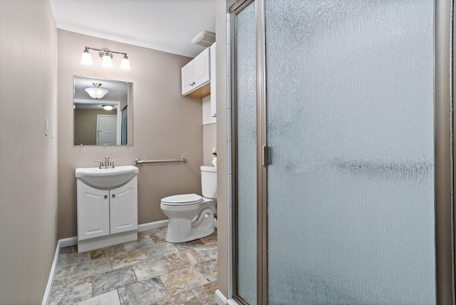 16 Deer Path Unit 1, Maynard, MA 01754 - full bath featuring baseboards, toilet, vanity, a stall shower, and stone finish floors