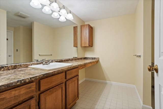 16 Deer Path Unit 1, Maynard, MA 01754 - bathroom featuring baseboards, vanity, and tile patterned flooring