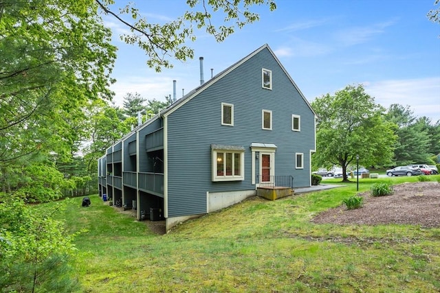 16 Deer Path Unit 1, Maynard, MA 01754 - back of property featuring a lawn