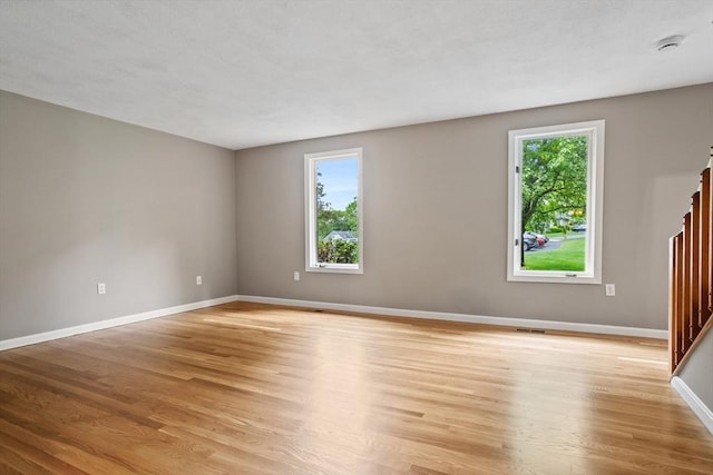 16 Deer Path Unit 1, Maynard, MA 01754 - empty room with light wood-style flooring, baseboards, and a smoke detector