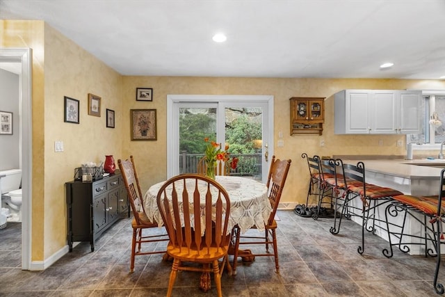 dining area with recessed lighting and baseboards