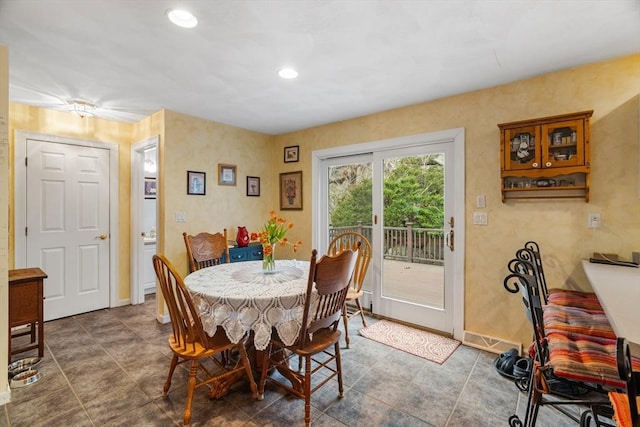 dining space with baseboards and recessed lighting