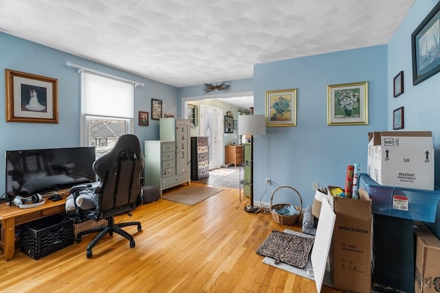 home office with wood-type flooring