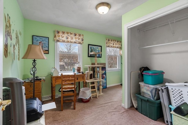 carpeted office space featuring visible vents and baseboards