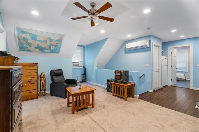 sitting room with carpet floors, recessed lighting, an AC wall unit, ceiling fan, and baseboards