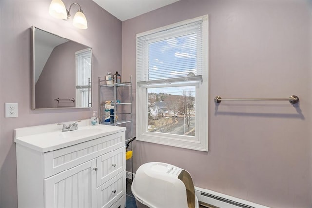 bathroom with a baseboard heating unit and vanity