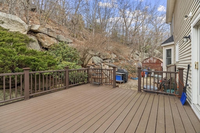 wooden terrace featuring area for grilling