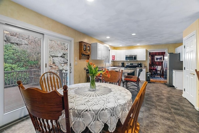 dining room with recessed lighting