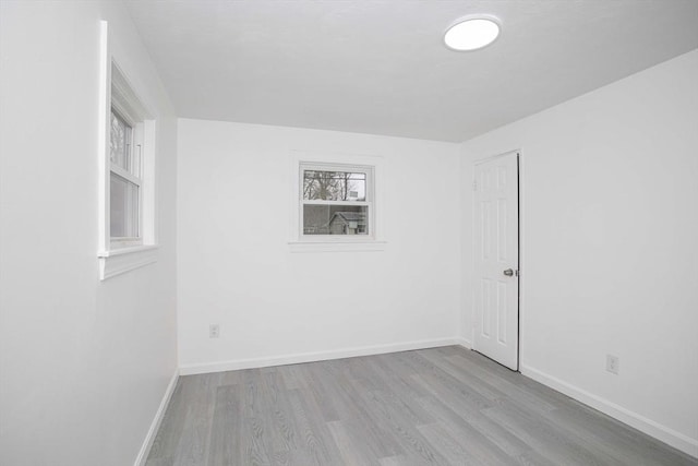 spare room with light hardwood / wood-style flooring