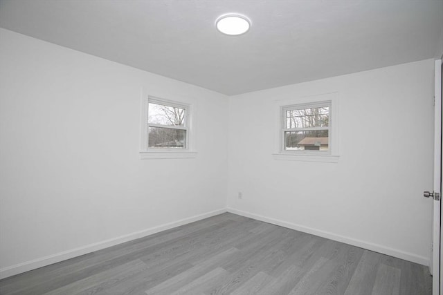 empty room with hardwood / wood-style floors