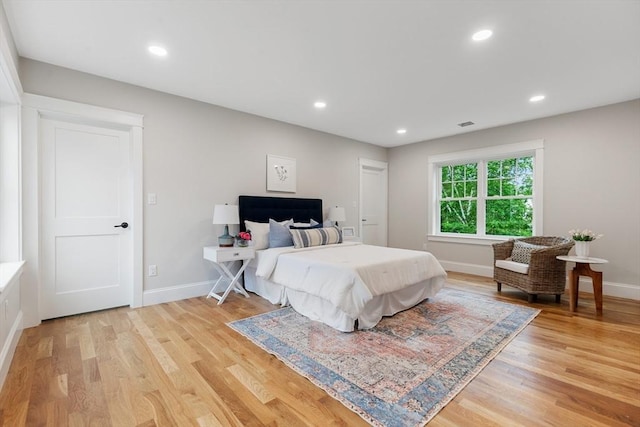 89 Wildwood St, Winchester, MA 01890 - bedroom with light wood-style flooring and recessed lighting