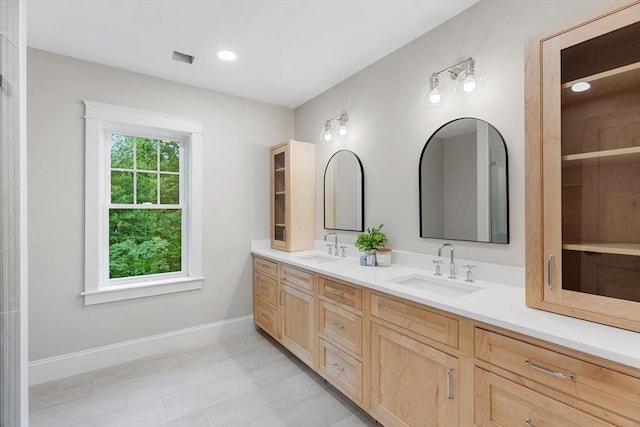 89 Wildwood St, Winchester, MA 01890 - full bathroom featuring double vanity and baseboards
