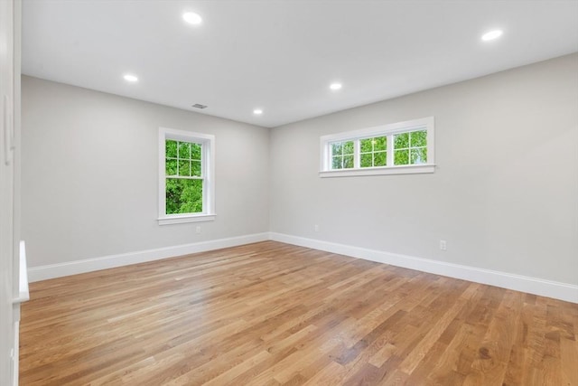 89 Wildwood St, Winchester, MA 01890 - spare room with healthy amount of natural light, light wood-style floors, and recessed lighting