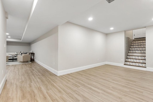 89 Wildwood St, Winchester, MA 01890 - unfurnished living room with light wood-type flooring, stairway, and recessed lighting