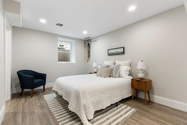 89 Wildwood St, Winchester, MA 01890 - bedroom with light wood-style floors and recessed lighting